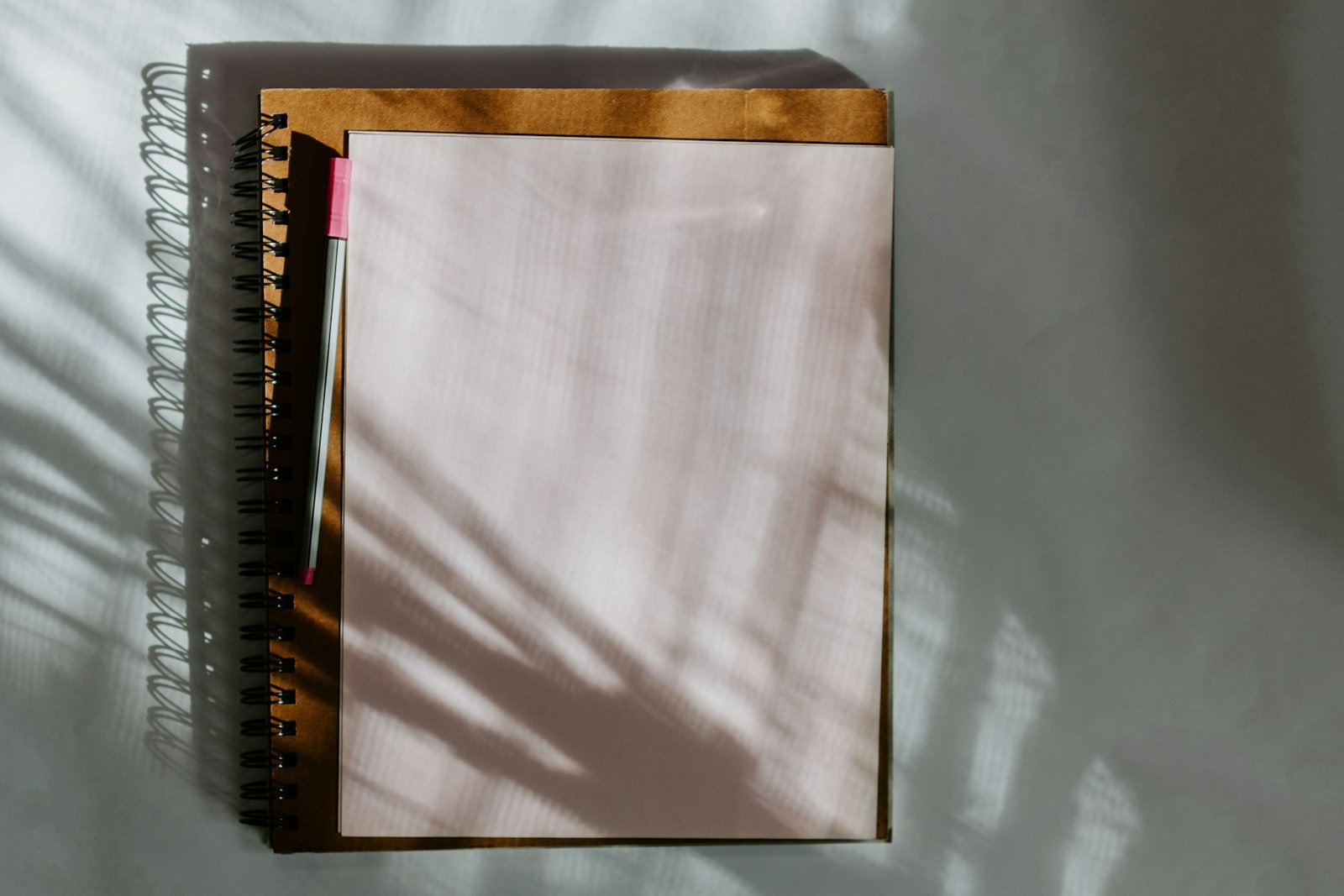 Dark wooden board on a desk, a quiet workspace for yearly planning with a calendar